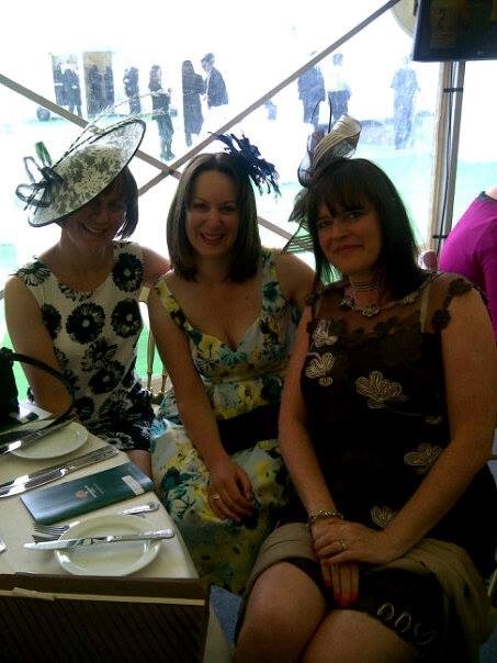 Clients wearing fascinators and occasion hats together at a race day event